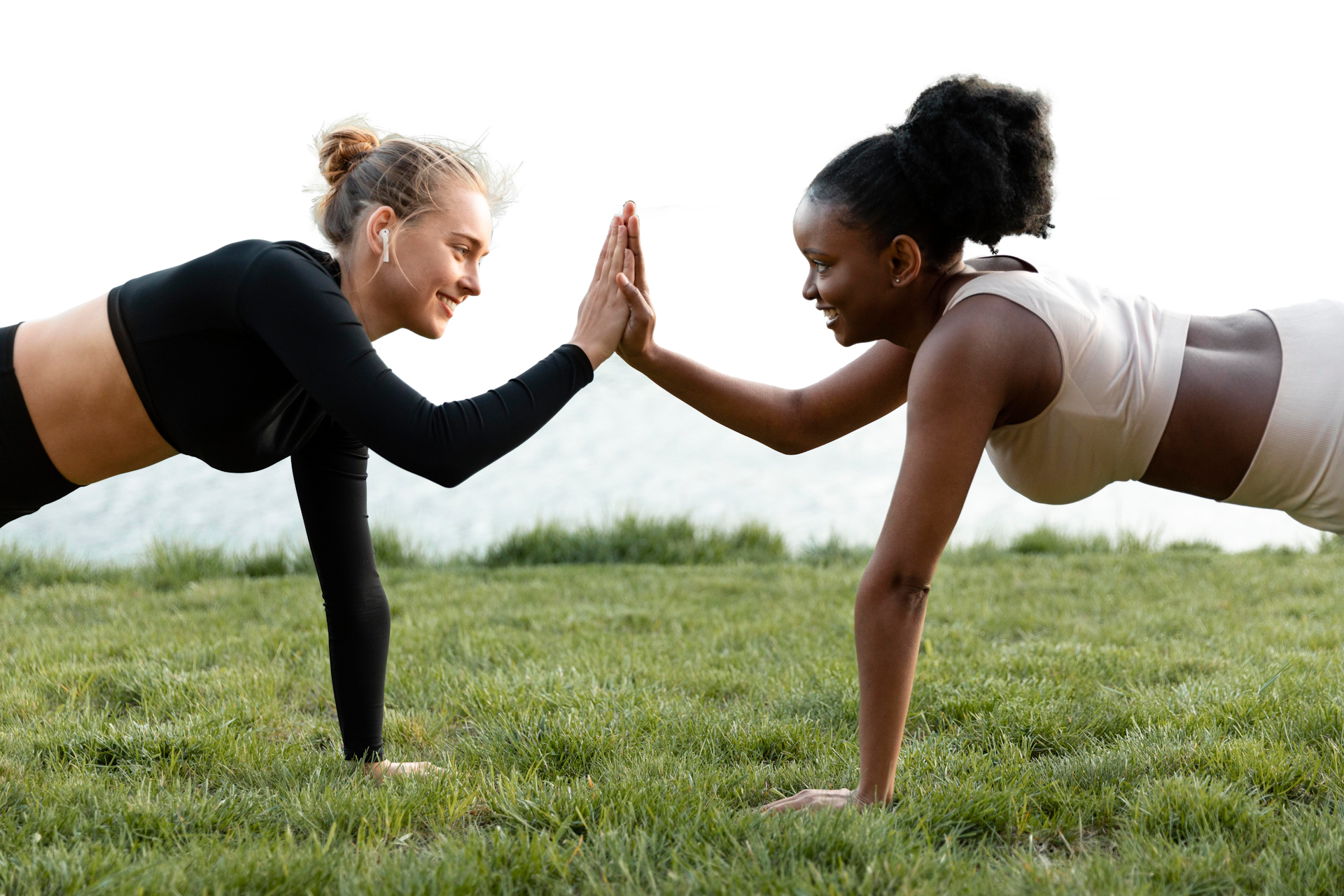 women working out high-fiving